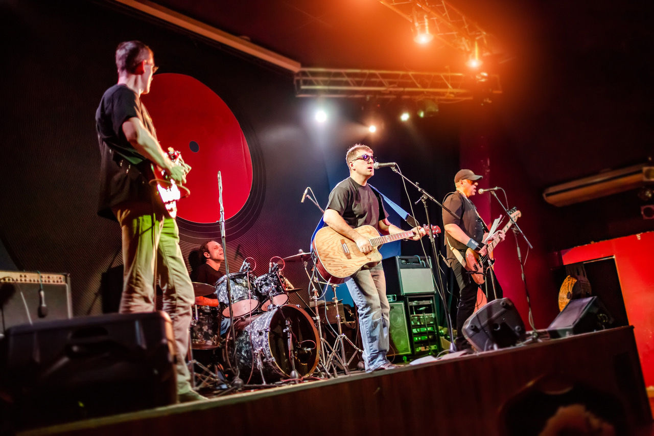 Band performs on stage in a nightclub